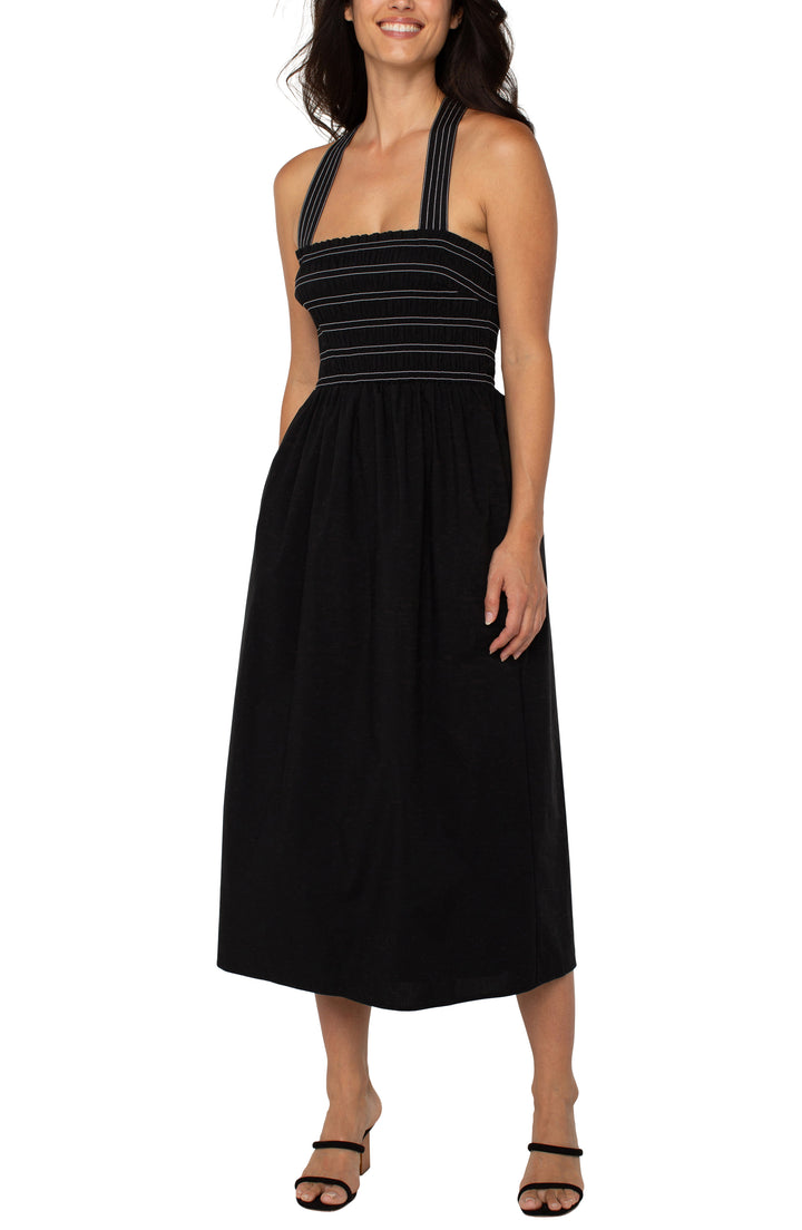 SLEEVELESS SMOCKED WOVEN MIDI DRESS - BLACK