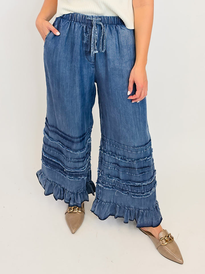 FRAYED WASHED RUFFLE HEM CHAMBRAY PANTS - DARK DENIM