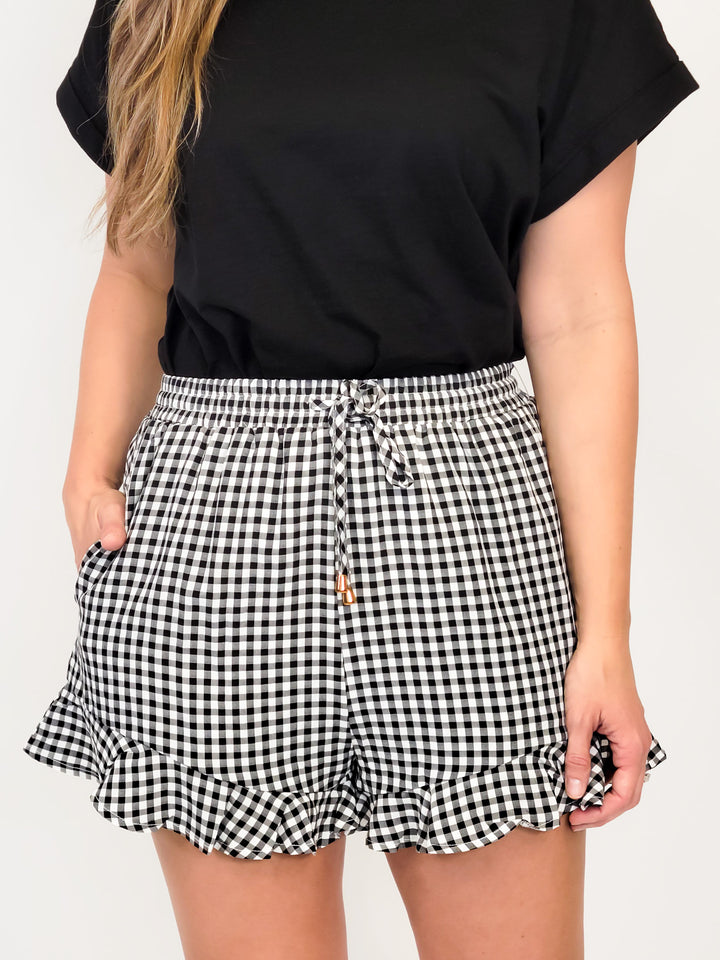 GINGHAM RUFFLE BUTTON PULL ON SHORTS - BLACK