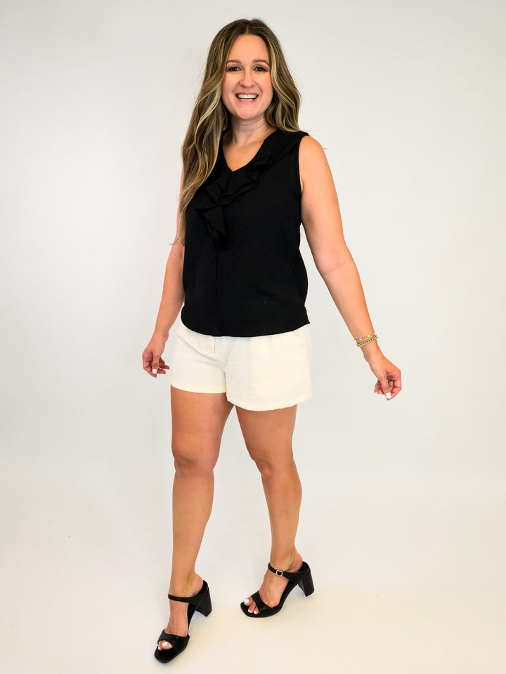 SOLID SLEEVELESS TOP WITH RUFFLE DETAIL - BLACK