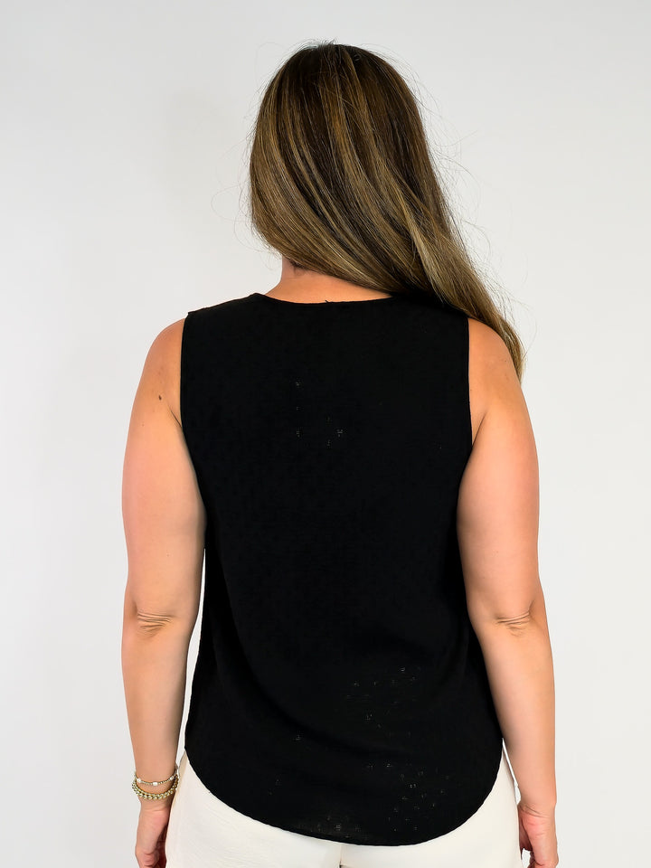 SOLID SLEEVELESS TOP WITH RUFFLE DETAIL - BLACK