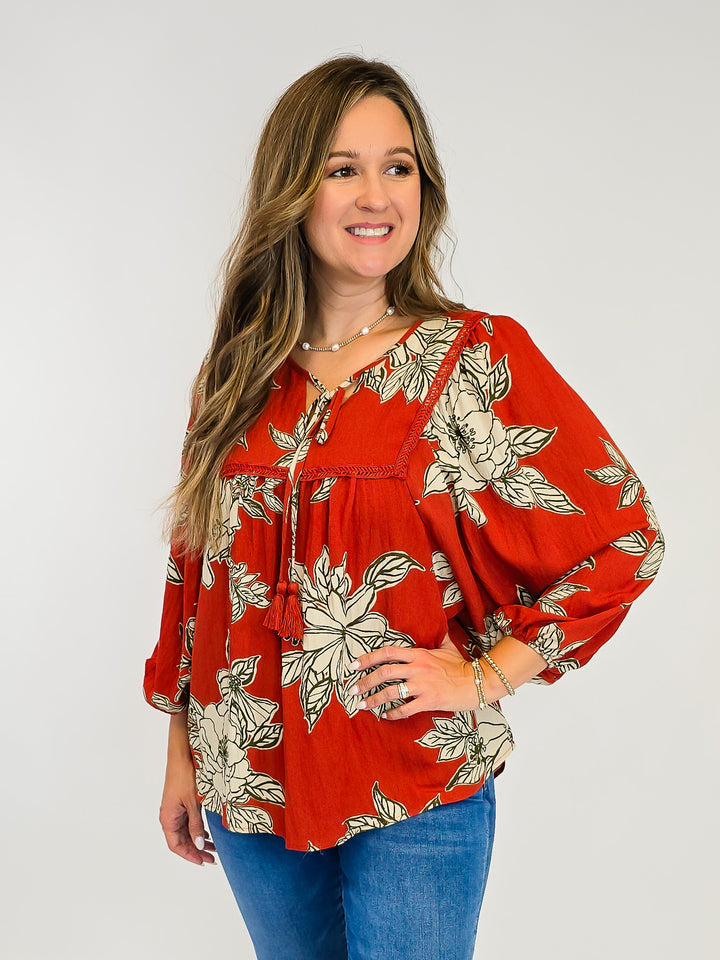 LARGE FLORAL WOVEN TOP W/TASSELS - RUST