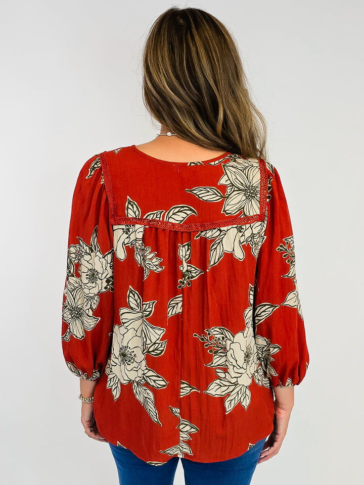 LARGE FLORAL WOVEN TOP W/TASSELS - RUST