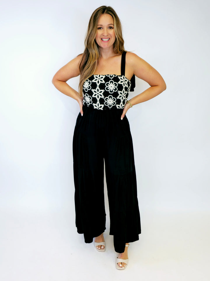 FLORAL EMBROIDERED TIERED LEG JUMPSUIT - BLACK