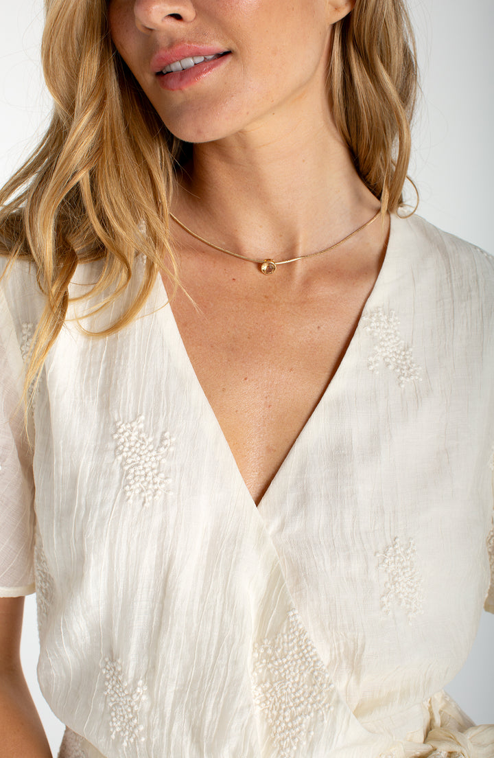 SHORT SLEEVE WRAP FRONT WOVEN TOP W/TIE - CREAM