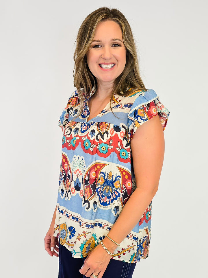 BORDER PRINT TOP WITH SHORT RUFFLE SLEEVES - BLUE MIX