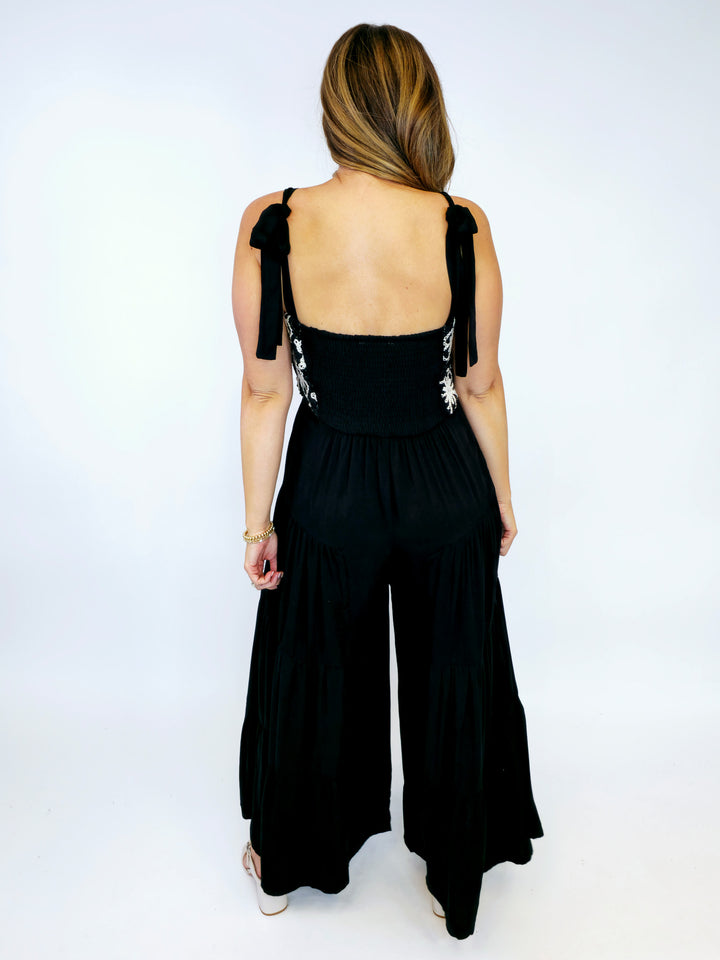 FLORAL EMBROIDERED TIERED LEG JUMPSUIT - BLACK