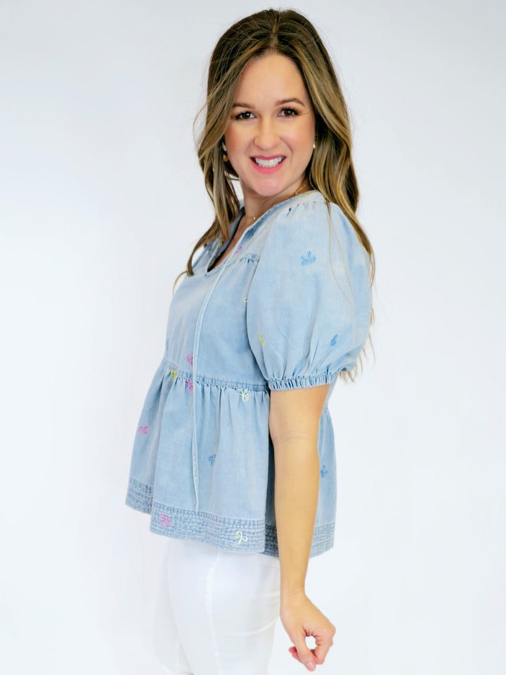 EMBROIDERED BOW CHAMBRAY TOP - LIGHT DENIM