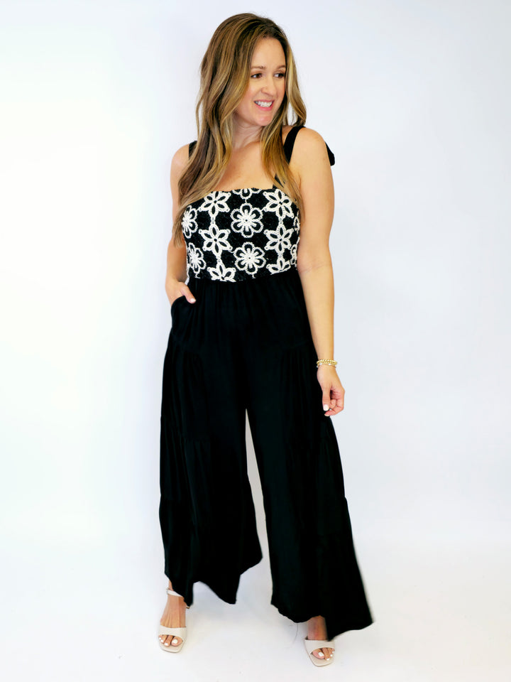 FLORAL EMBROIDERED TIERED LEG JUMPSUIT - BLACK