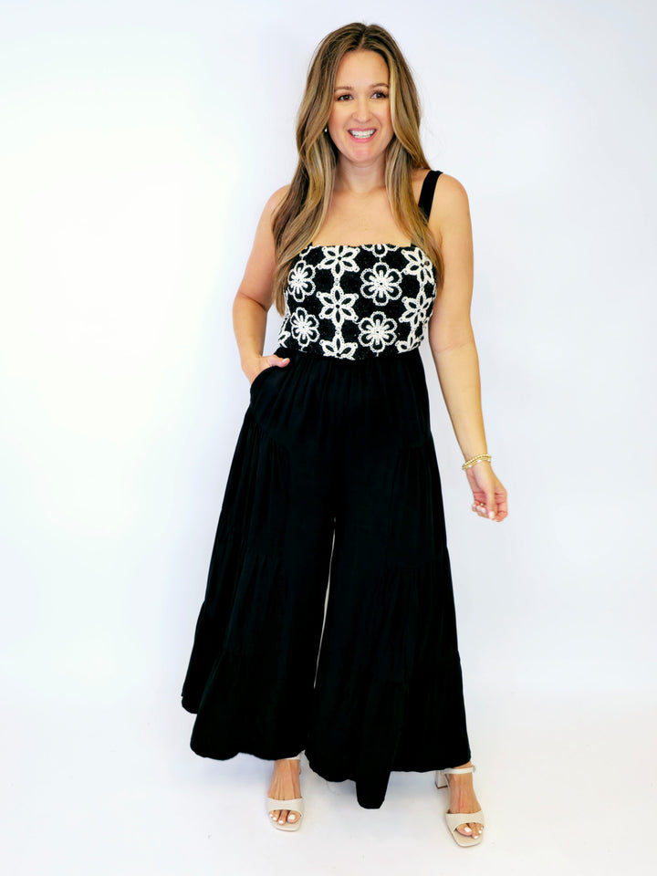 FLORAL EMBROIDERED TIERED LEG JUMPSUIT - BLACK